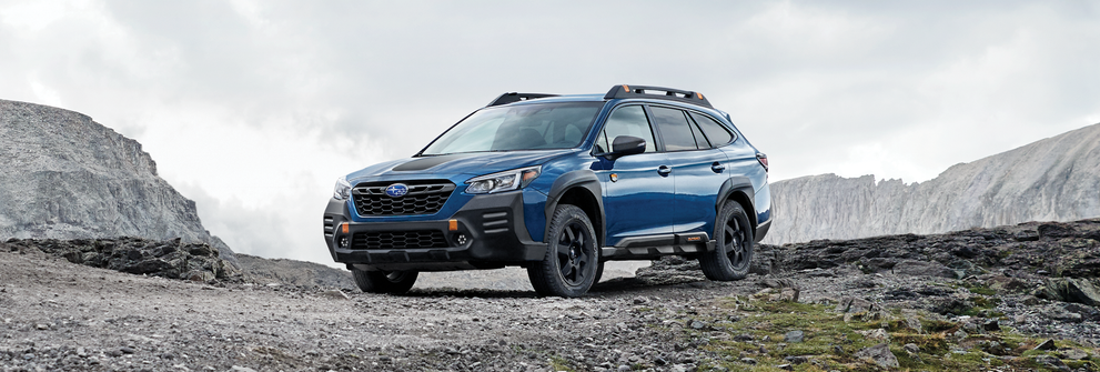A 2023 Outback Wilderness parked in the mountains. | Subaru of Grand Blanc in Grand Blanc MI
