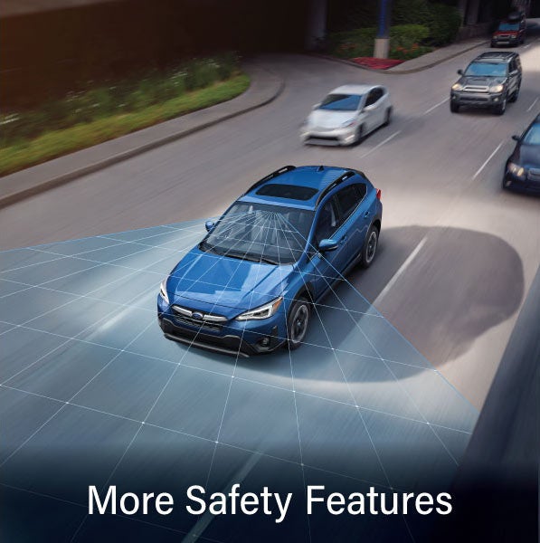 A Subaru Crosstrek in blue with the words &ldquo;More Safety Features&ldquo;. | Subaru of Grand Blanc in Grand Blanc MI